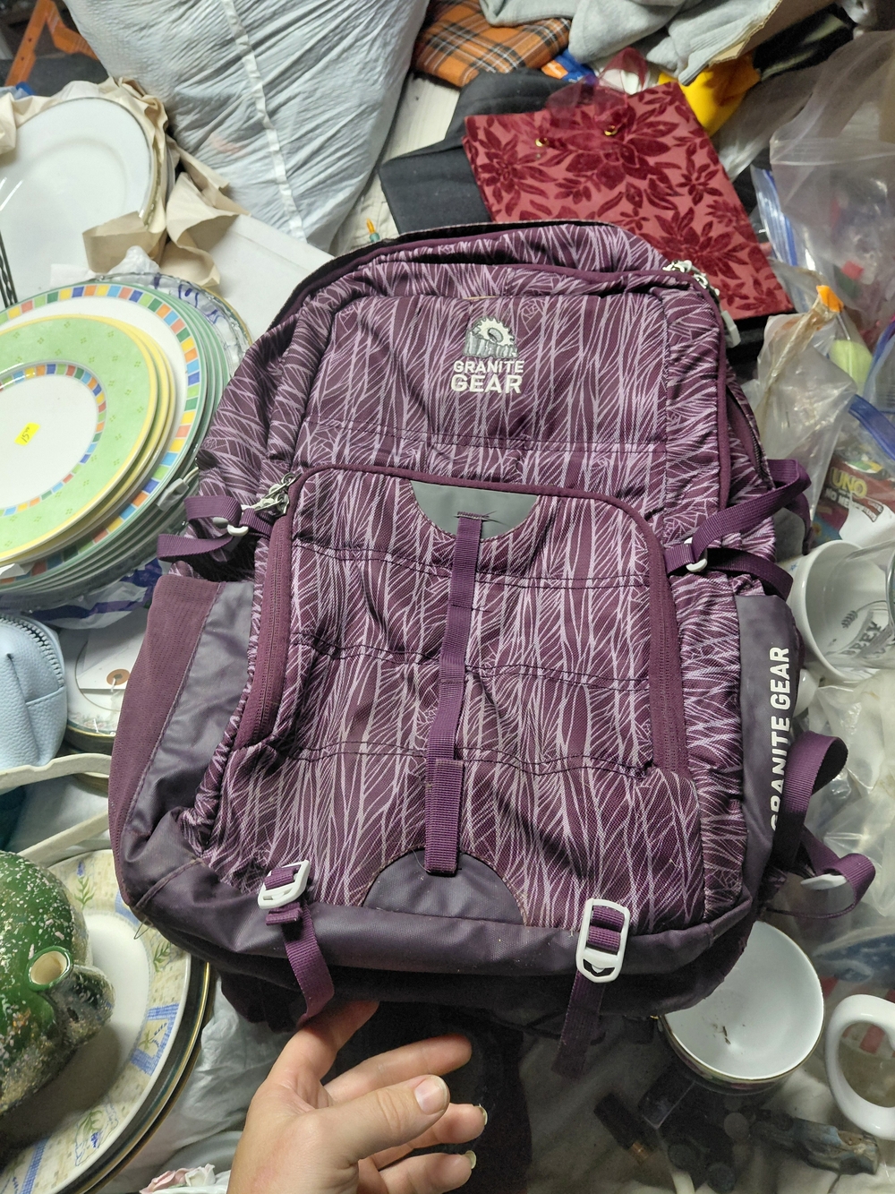purple leaf-print Granite Gear Barrier backpack.